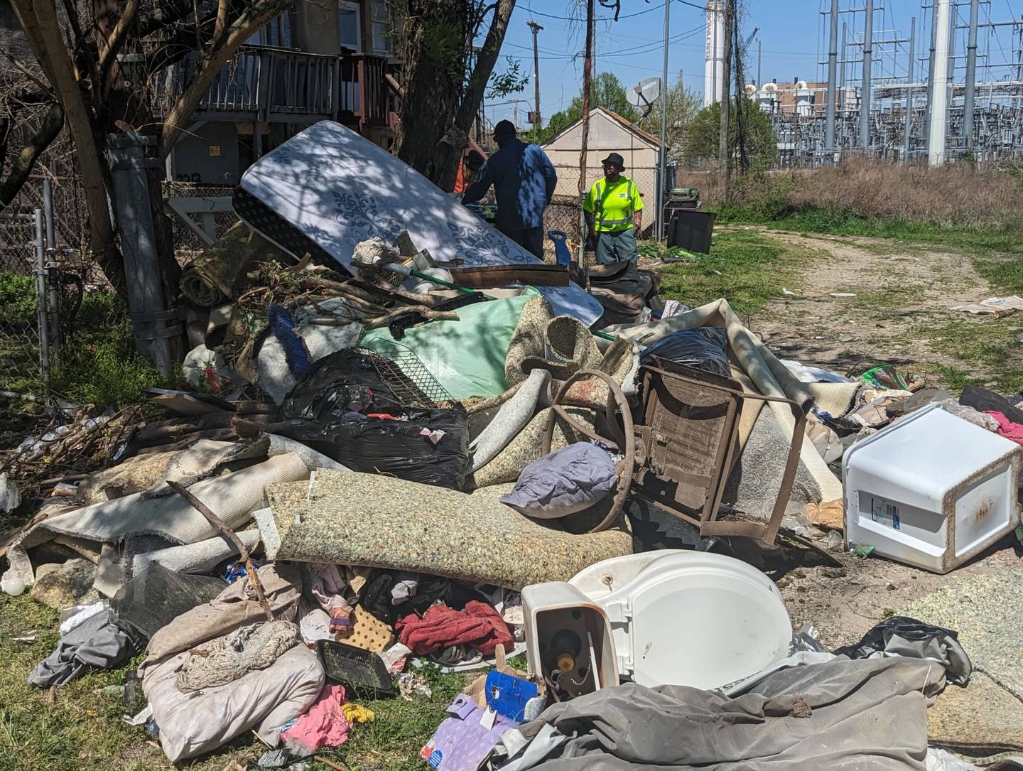 DPW tackles a pile of debris behind a home in Westport.