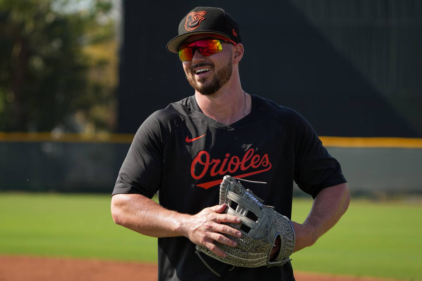 Ryan McKenna (26) reacts to a teammate’s joke during batting practice at Ed Smith Stadium in Sarasota on 2/24/23. The Baltimore Orioles’ Spring Training session runs from mid-February through the end of March.
