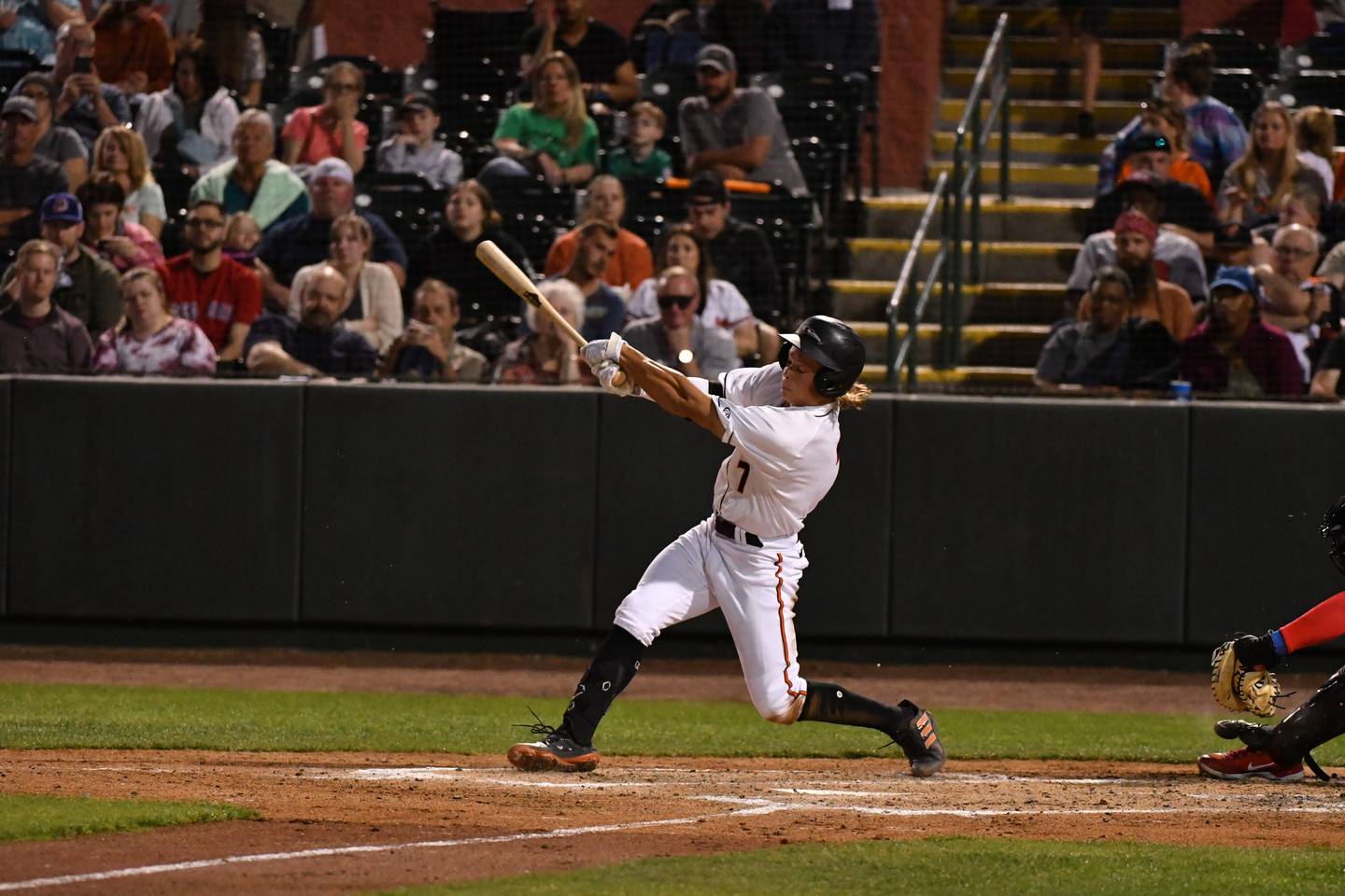This photo shows Jackson Holliday, a left-handed hitter, continuing his swing after making contact with a baseball.