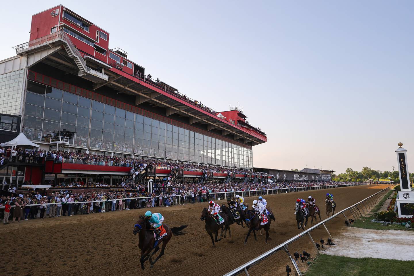 Jockey Jose Ortiz #5 riding Early Voting and the field make the first pass into the first turn during the 147th Running of the Preakness Stakes at Pimlico Race Course on May 21, 2022 in Baltimore, Maryland.