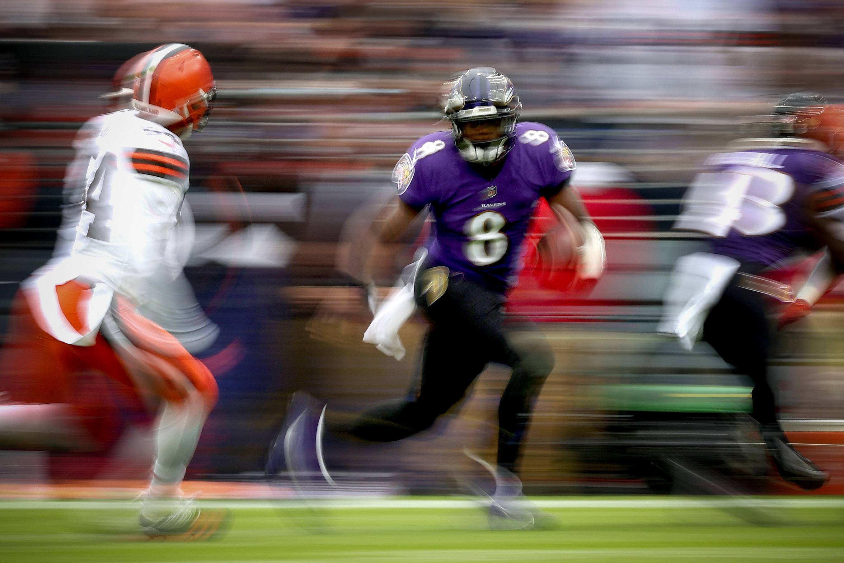 BALTIMORE, MARYLAND - OCTOBER 23: Lamar Jackson #8 of the Baltimore Ravens scrambles with the ball during the second half of the game against the Cleveland Browns at M&T Bank Stadium on October 23, 2022 in Baltimore, Maryland.
