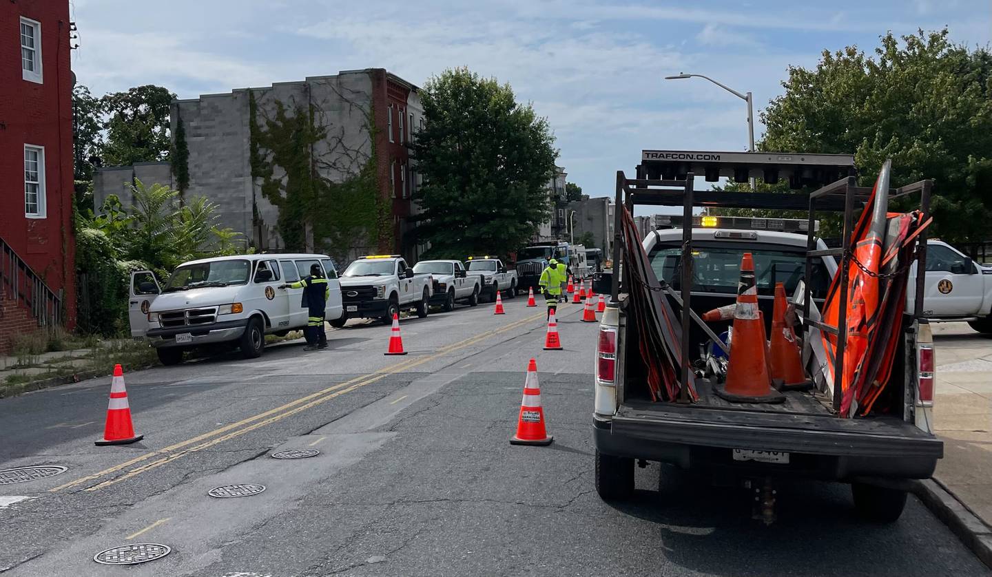 Baltimore Department of Public Works crews stage a response to an E. coli contamination in West Baltimore at the corner of West Lafayette Avenue and North Calhoun Street.