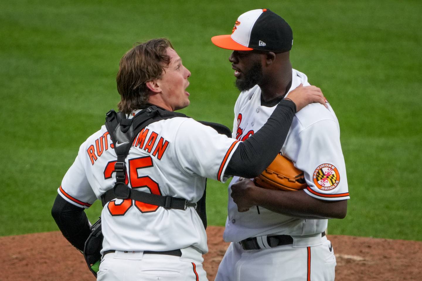 Baltimore Orioles catcher Adley Rutschman (35) celebrates with relief pitcher Felix Bautista (74) at the end of a baseball game against the New York Yankees on Friday, April 7. The Orioles hosted the Yankees for their Home Opener at Camden Yards.