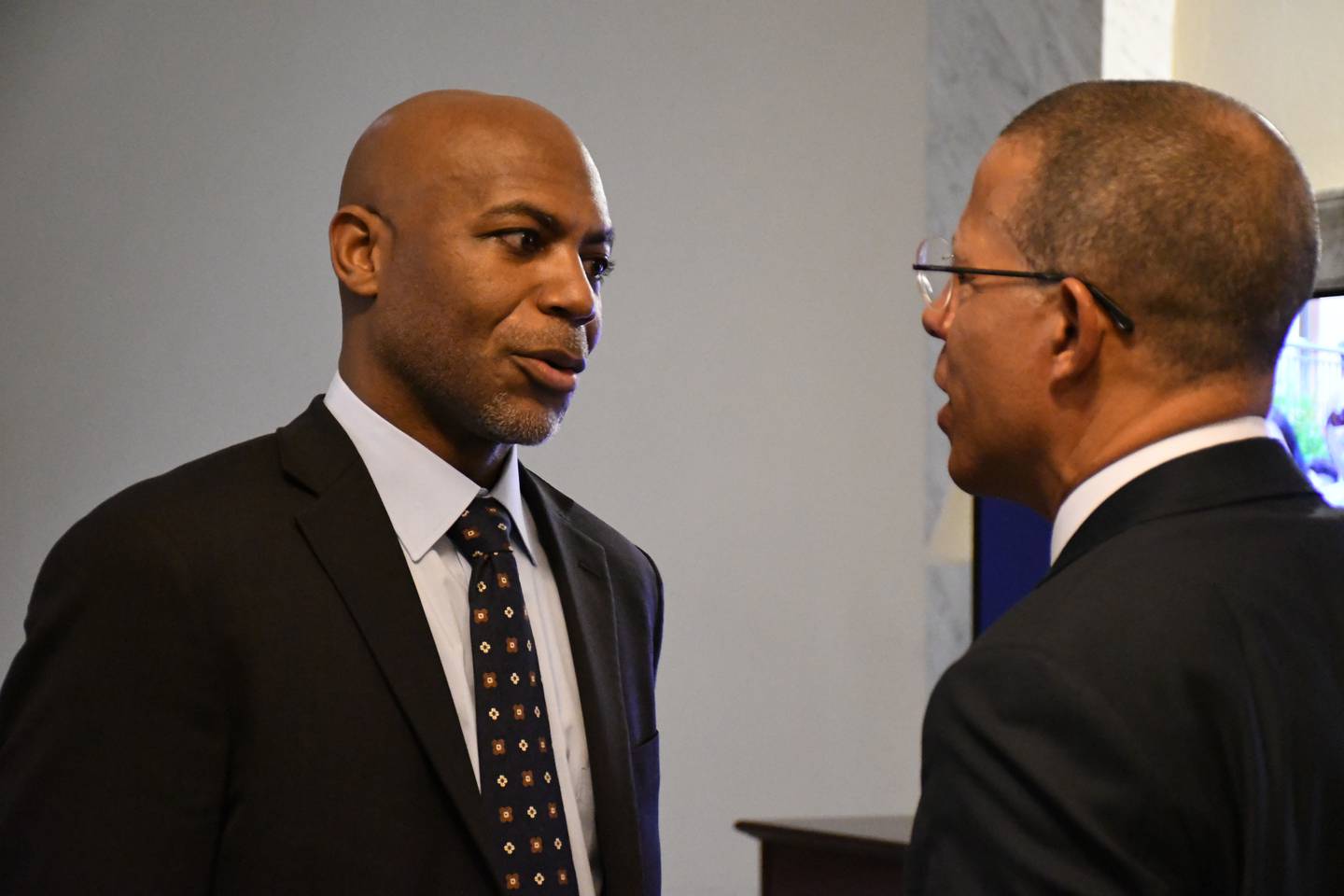 U.S. Attorney for the District of Maryland Erek Barron, left, and Maryland Attorney General Anthony Brown talk in the State House in Annapolis on Thursday, Jan. 19, 2023.