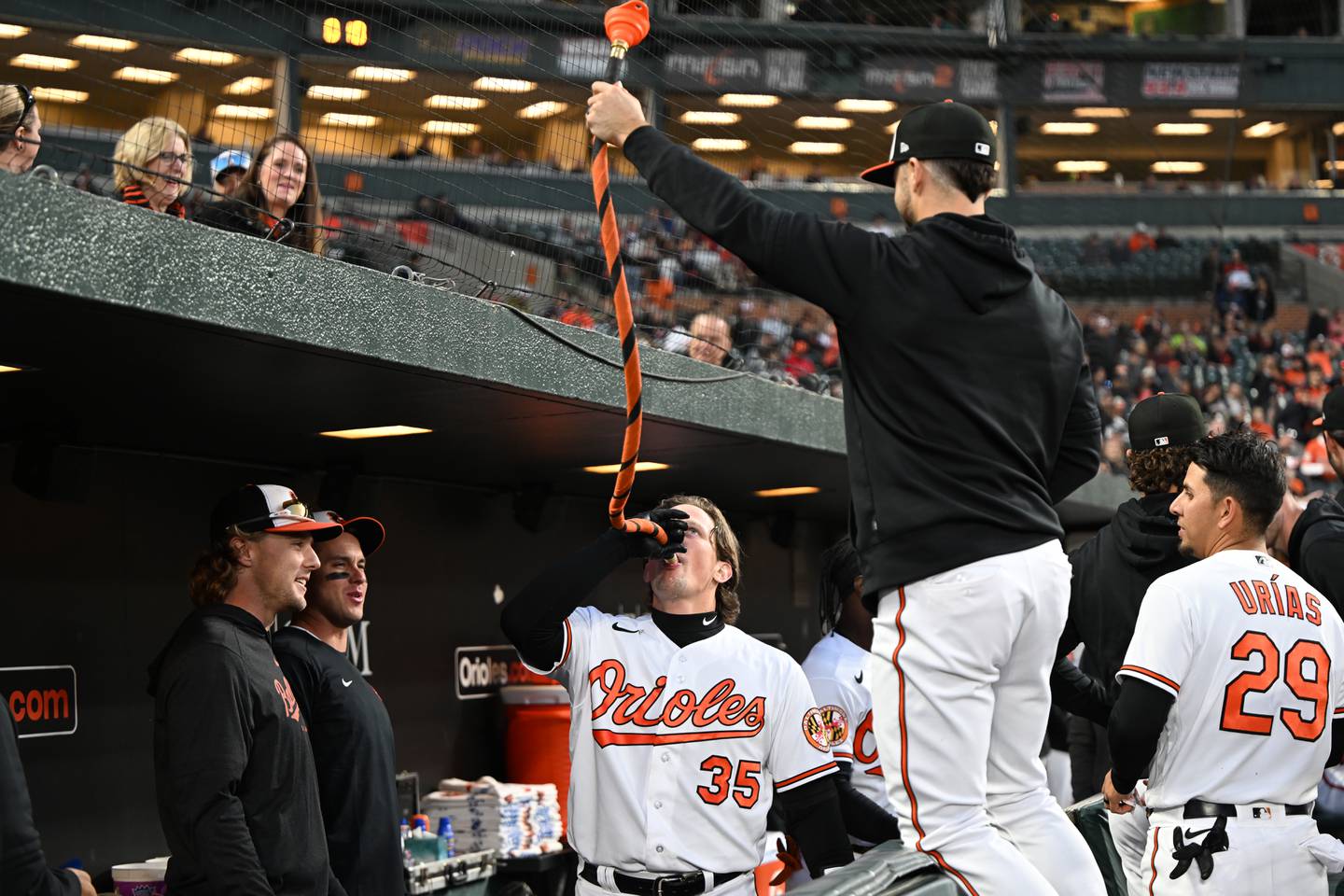 Baltimore Orioles’ Adley Rutschmann smiles as he drinks from the home run funnel after hitting a solo homer against the Oakland Athletics in the third inning of a baseball game on Monday, April 10, 2023, in Baltimore.