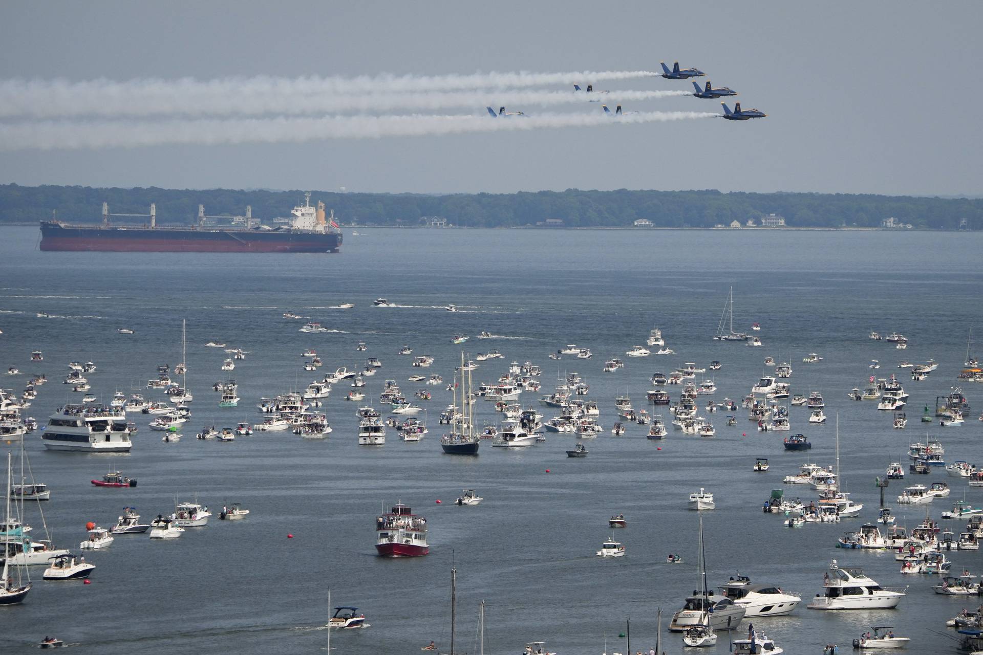 The U.S. Navy Blue Angels fly past the Naval Academy Chapel dome on May 24, 2023, as seen from the top of the State House. The show is part of a series of events during the Naval Academy’s Commissioning Week, all leading up to the graduation ceremony on Friday morning.
