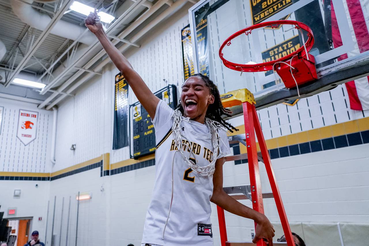 Harford Tech's Anyia Gibson celebrates after cutting down the net after the MPSSAA High School Girls 2A East Region Playoff Final between the Fallston Cougars and Harford Tech Cobras at Harford Tech High School in Bel Air, Maryland on March 1, 2023. Harford Tech won 41-27. photo by Scott Serio for The Baltimore Banner