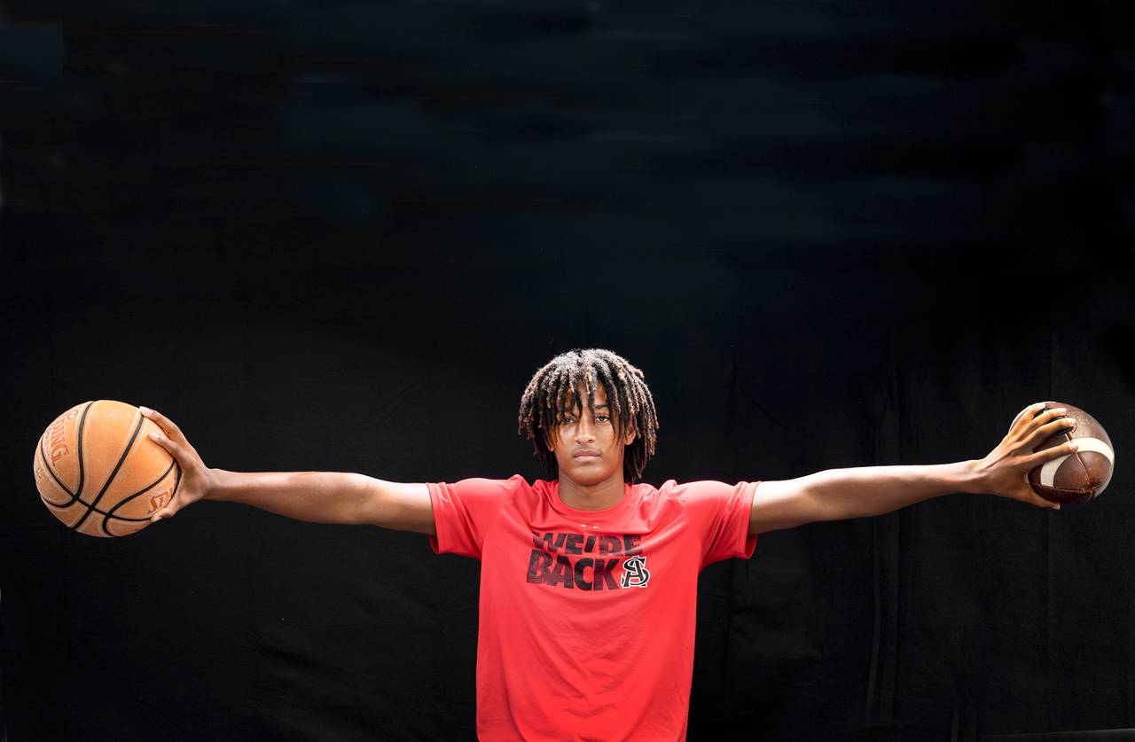Malik Washington, a 6-foot-6, 210-pound basketball and football star.