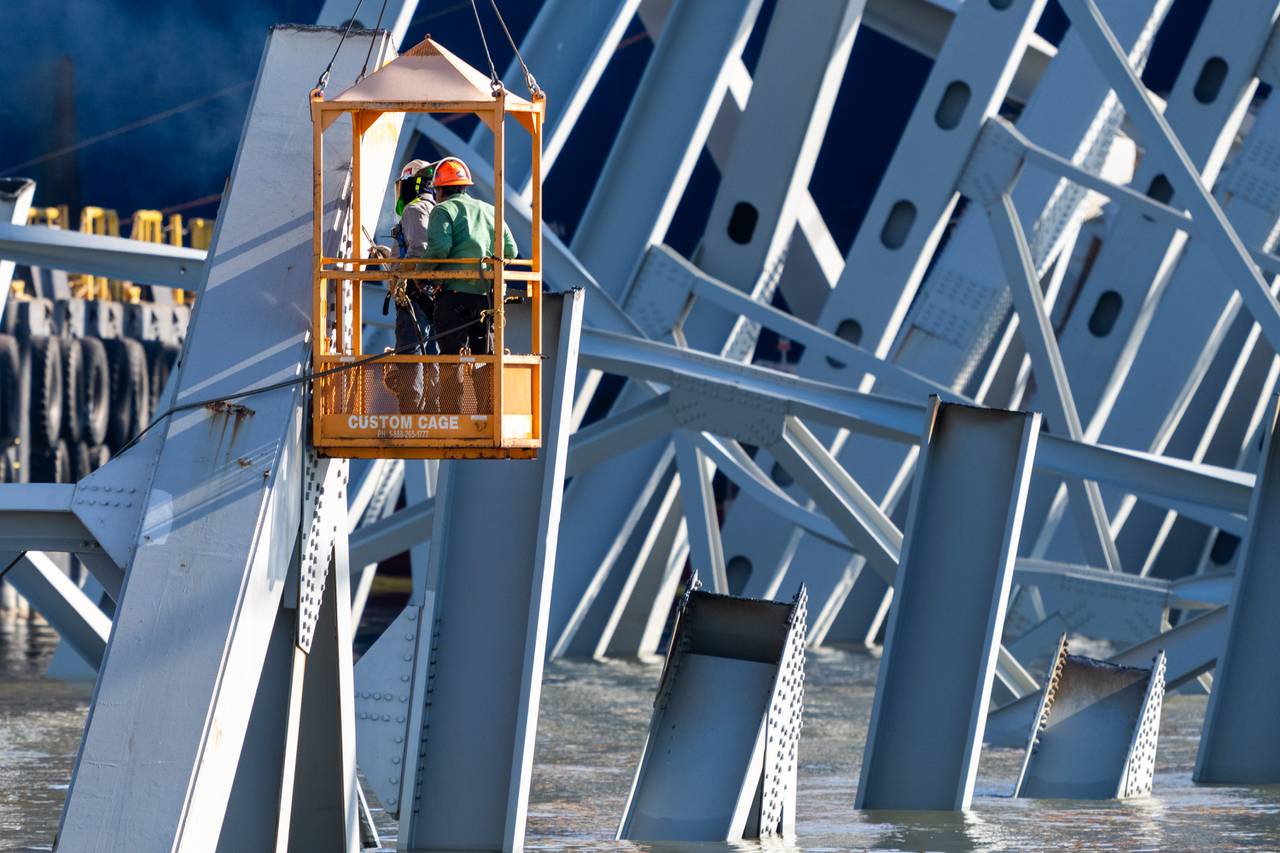 Workers cut through steel from the Key Bridge wreckage on Tuesday, April 16, 2024.