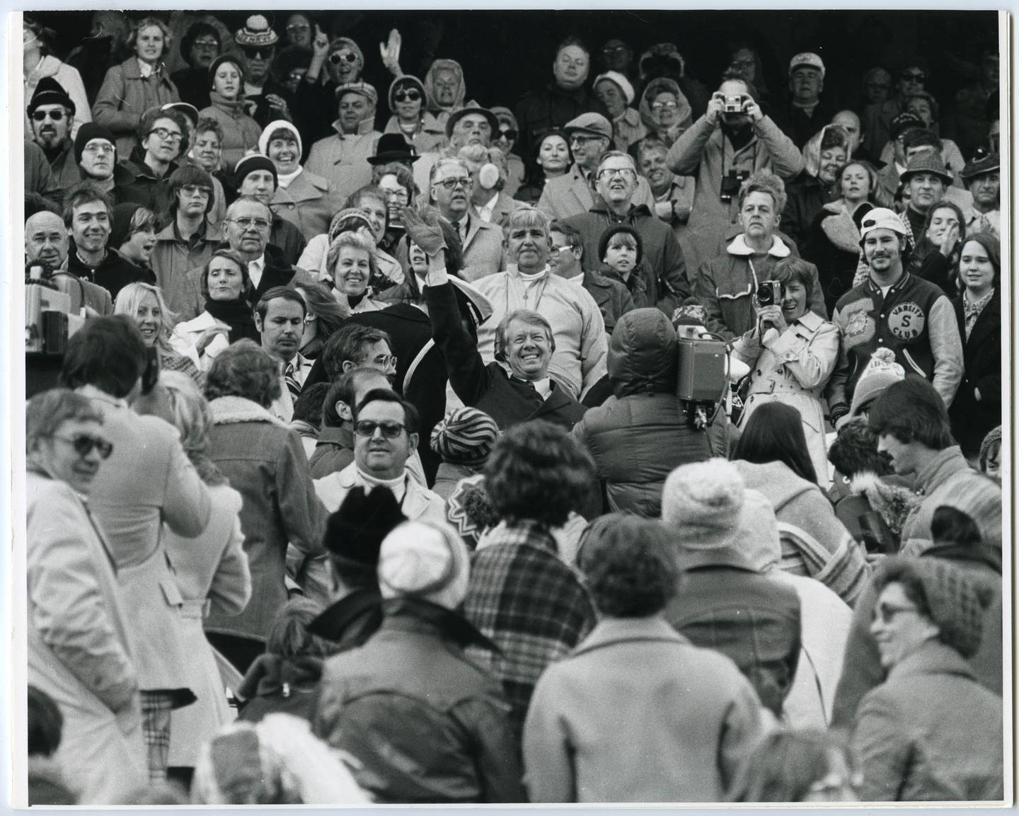 President Jimmy Carter, center, and his wife Rosalynn Carter join fans at Navy-Marine Corps Memorial Stadium in Annapolis on Nov. 12, 1977, for the game between the Navy Midshipmen and Georgia Tech. Navy beat the Yellow Jackets, 20-16.