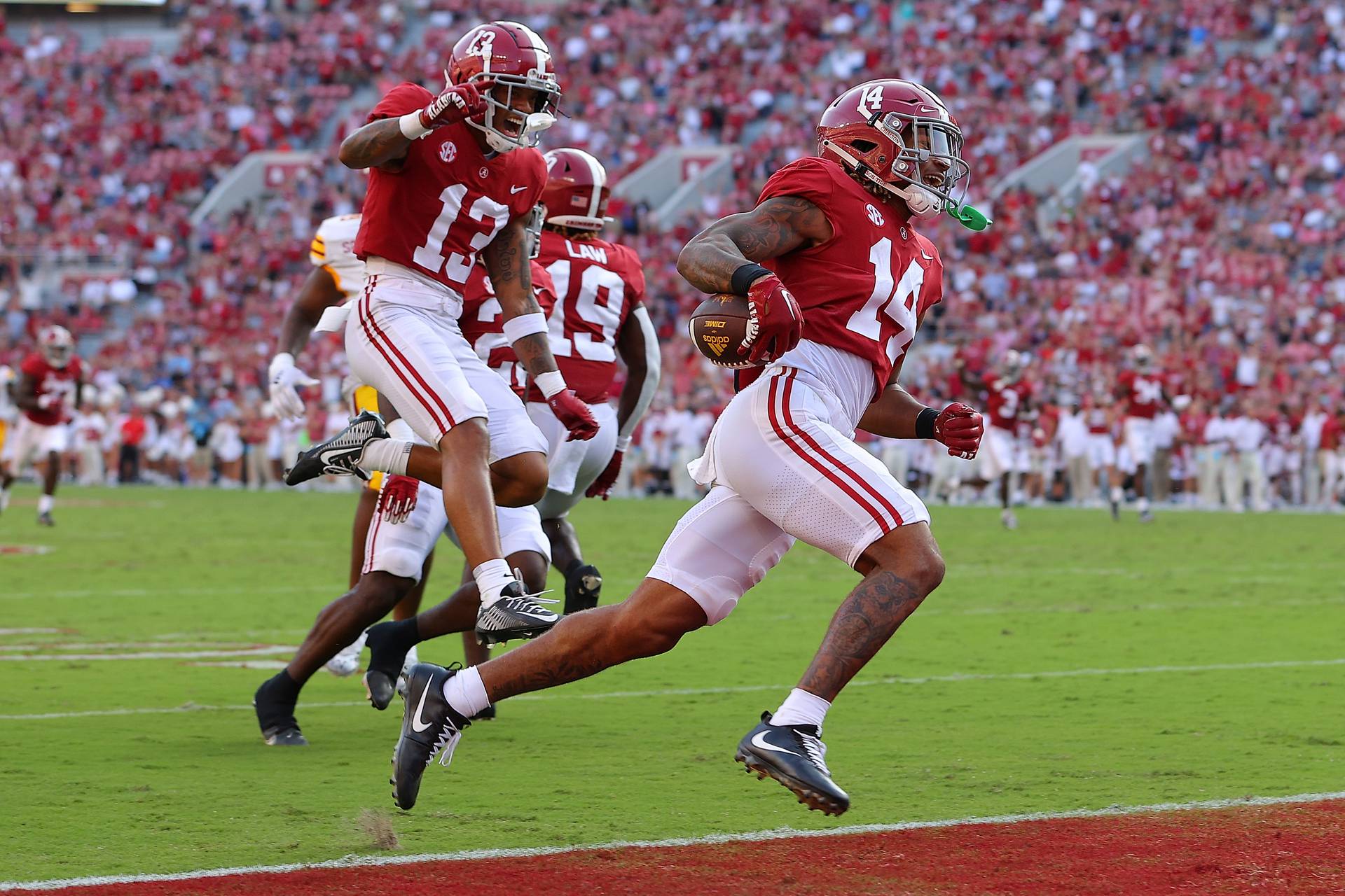 TUSCALOOSA, ALABAMA - SEPTEMBER 17:  Brian Branch #14 of the Alabama Crimson Tide returns this punt for a touchdown against the Louisiana Monroe Warhawks during the fourth quarter at Bryant-Denny Stadium on September 17, 2022 in Tuscaloosa, Alabama.