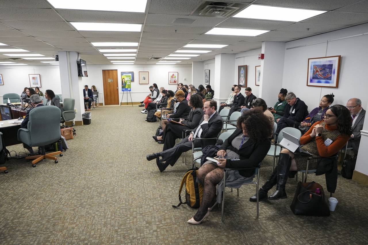 A crowd of parents and activists listen to Theresa Concepción and Claude de Vastey Jones present oral arguments in the appeal case about Steuart Hill Academic Academy in downtown Baltimore on March 28, 2023.