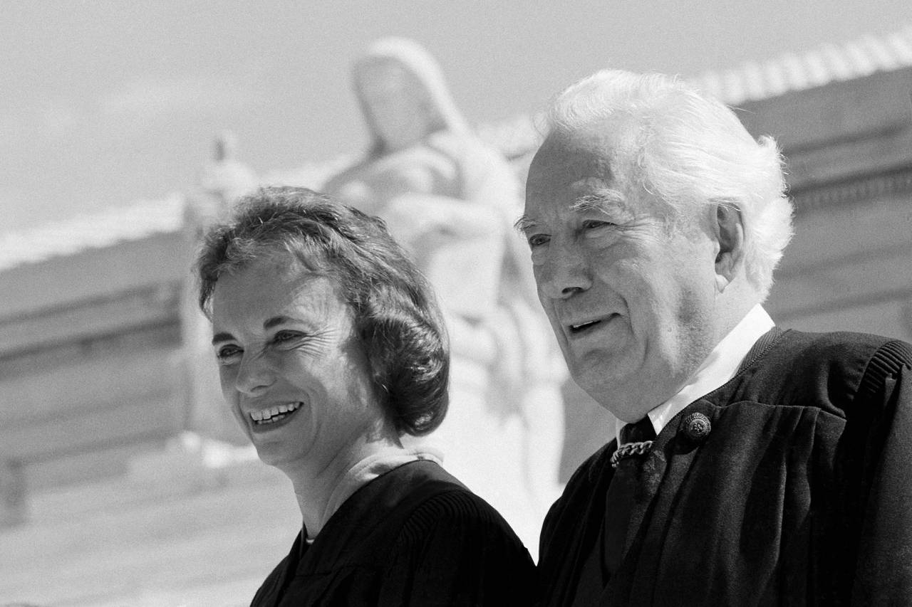Sandra Day O'Connor and Chief Justice Warren Burger pose for pictures at the U.S. Supreme Court building in Washington, Sept. 25, 1981. O'Connor will be sworn in as the first female justice of the Supreme Court later this afternoon. O'Connor, who joined the Supreme Court in 1981 as the nation's first female justice, has died at age 93. (AP Photo)