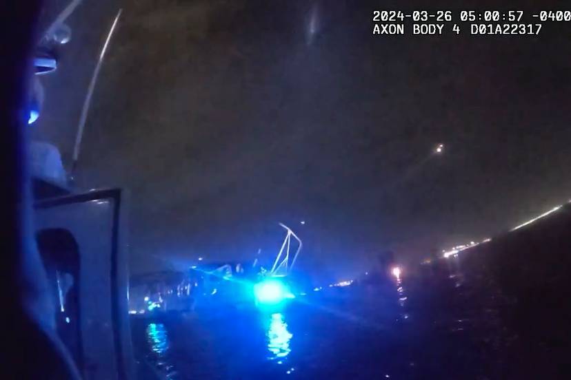 A screenshot from body camera footage by the Maryland Natural Resources Police of the Francis Scott Key Bridge collapse site on the Patapsco River in the early morning hours. The screenshot indicates the video was taken at just past 5 a.m. on March 26, 2024.
