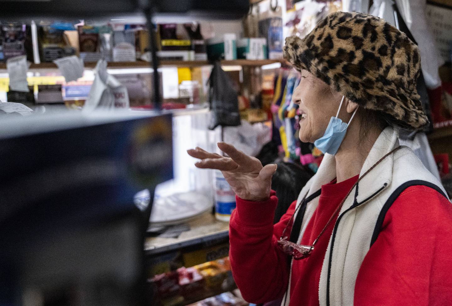 Yong Sun Pak waves goodbye to customers as they check out at Lee's Mini Market, in Baltimore, Thursday, December 1, 2022.