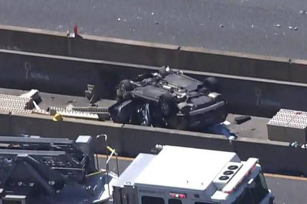 A vehicle sits overturned in a construction zone on the Baltimore Beltway on March 22, 2023. Six construction workers were killed in the crash.