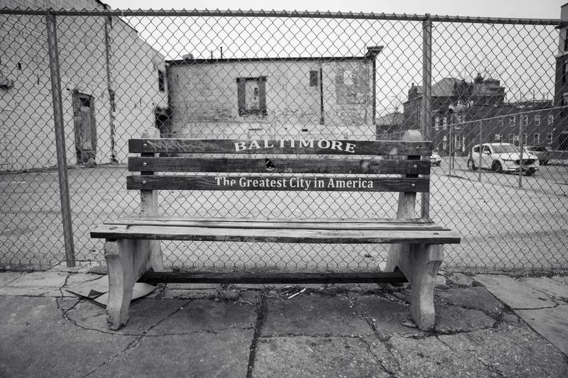 A bench boasting the city slogan "Baltimore - The Greatest City in America."