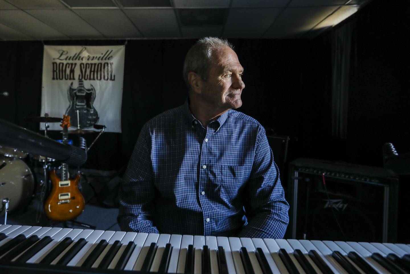 Bruce Anderson, organist for The Capitals for twenty-two years, was recently laid off when they informed him they no longer needed his services. He is pictured here in his Lutherville Music School.