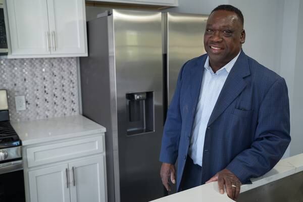 Realtor Donnell Spivey poses for a portrait in one of the homes he’s selling on Thursday, April 20.