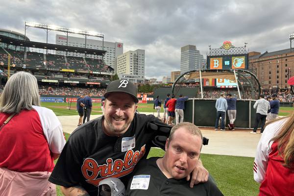 Derek (left) and Shane Hargest enjoy their time on the field during batting practice ahead of Saturday’s Orioles game against the Boston Red Sox