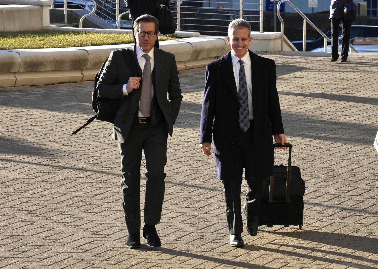 Louis Angelos, left, enters the Baltimore County Courts Building with his attorney, Jeffrey Nusinov, on January 26, 2023.