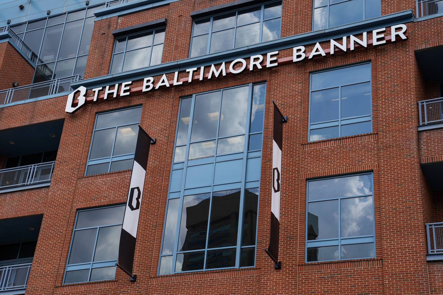 6/8/22—Exterior of The Baltimore Banner office sign with the hanging banners.