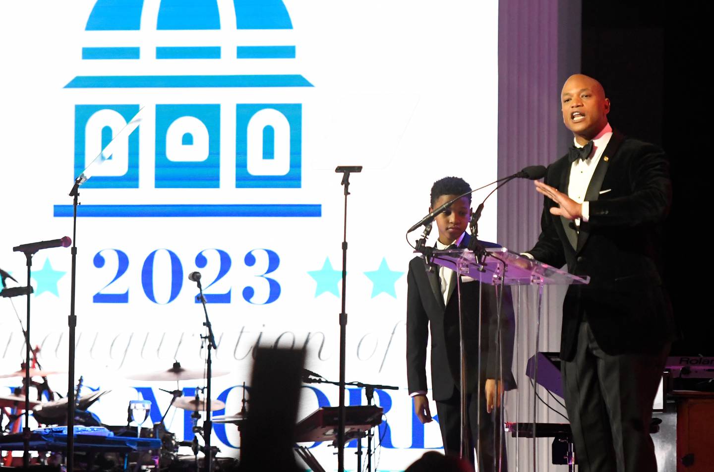 Gov. Wes Moore, with his son, James, 11, speaks during his inaugural ball, Wednesday, Jan. 18, 2023, in Baltimore.