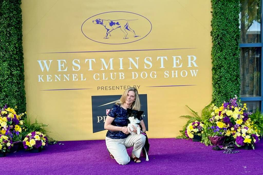 Cynthia Hornor, smiles with her dog Nimble, who made history at the annual Westminster Kennel Club Dog Show in Queens, New York.