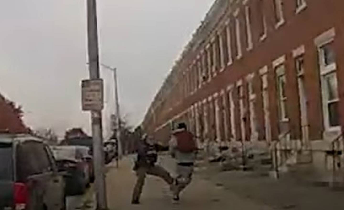 Baltimore Police Officer Brittany Routh attempts to tackle 27-year-old Hunter Jessup during a foot chase on Nov. 7, 2023. Her body cam footage showed she was slightly ahead of him when she attempted to tackle him from the side as she exited the car she was riding in and bolted onto the sidewalk. Jessup dodged the tackle and was shot and killed by officers after firing at them a few seconds later.