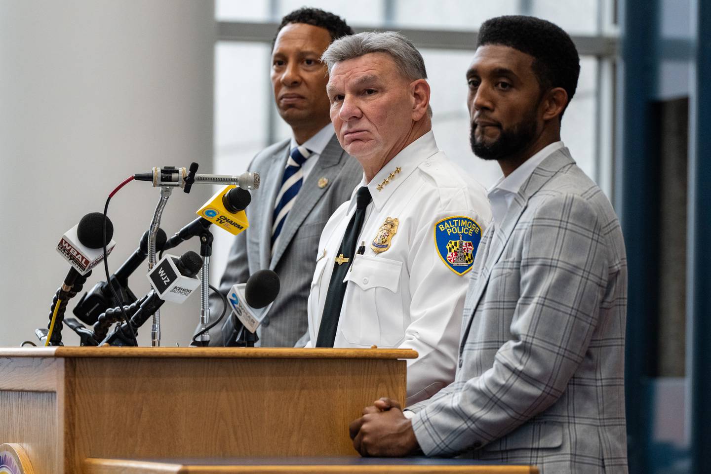 From left, State's Attorney for Baltimore City Ivan J. Bates, Baltimore Police Commissioner Rich Worley and Baltimore Mayor Brandon Scott hold a press conference about the killing of Pava LaPere at BPD headquarters on Tuesday, Sept. 26, 2023.
