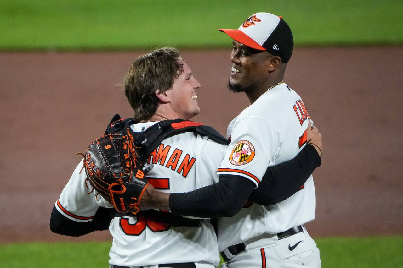 Baltimore Orioles relief pitcher Yennier Cano (78) hugs catcher Adley Rutschman (35) after securing the final out to win a baseball game against the Tampa Bay Rays at Camden Yards on Wednesday, May 10. The Orioles beat the Rays, 2-1, to win the 3-game series.