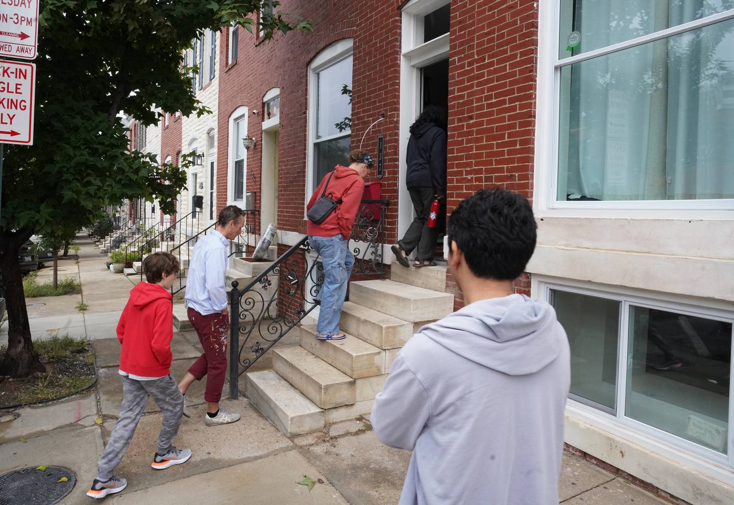Breath of God Lutheran Church in Highlandtown renovated a vacant house that is to become a home for a new refugee family. Volunteers painted the house Friday and Saturday in hopes of having the home ready for occupancy by February 2023.  Volunteers enter the home needing work.