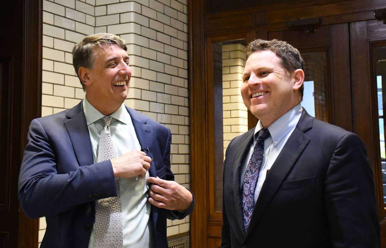 Sen. Guy Guzzone, left, and Del. Ben Barnes, right, share a laugh before briefing reporters on a deal reached for next year's state budget at the State House on Wednesday, April 3, 2024.