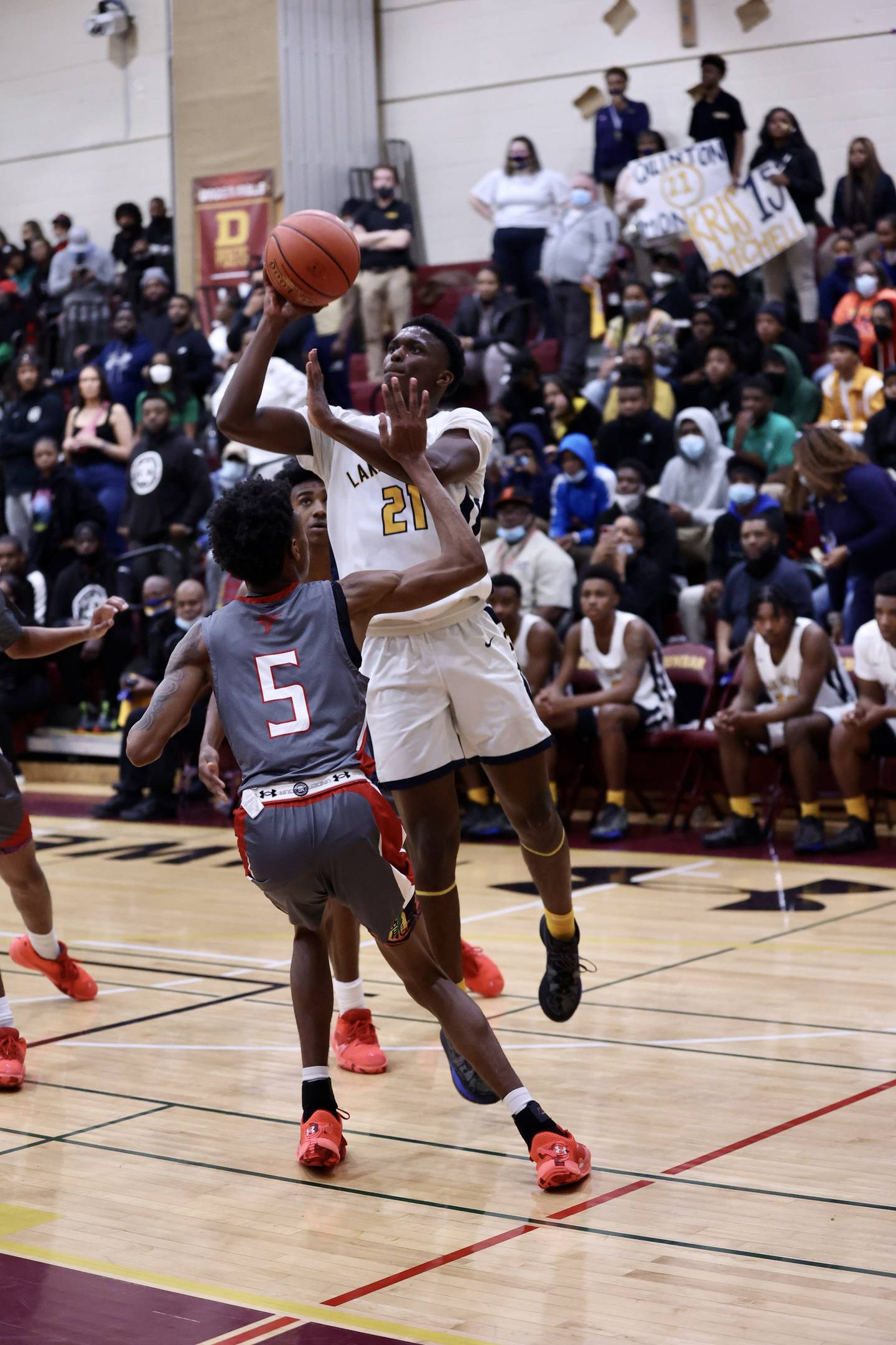 Quentin Moore, pulling up for a shot against Edmondson in last season's Baltimore City title game, led Lake Clifton to three victories over the Red Storm. The rivals meet next week in East Baltimore.