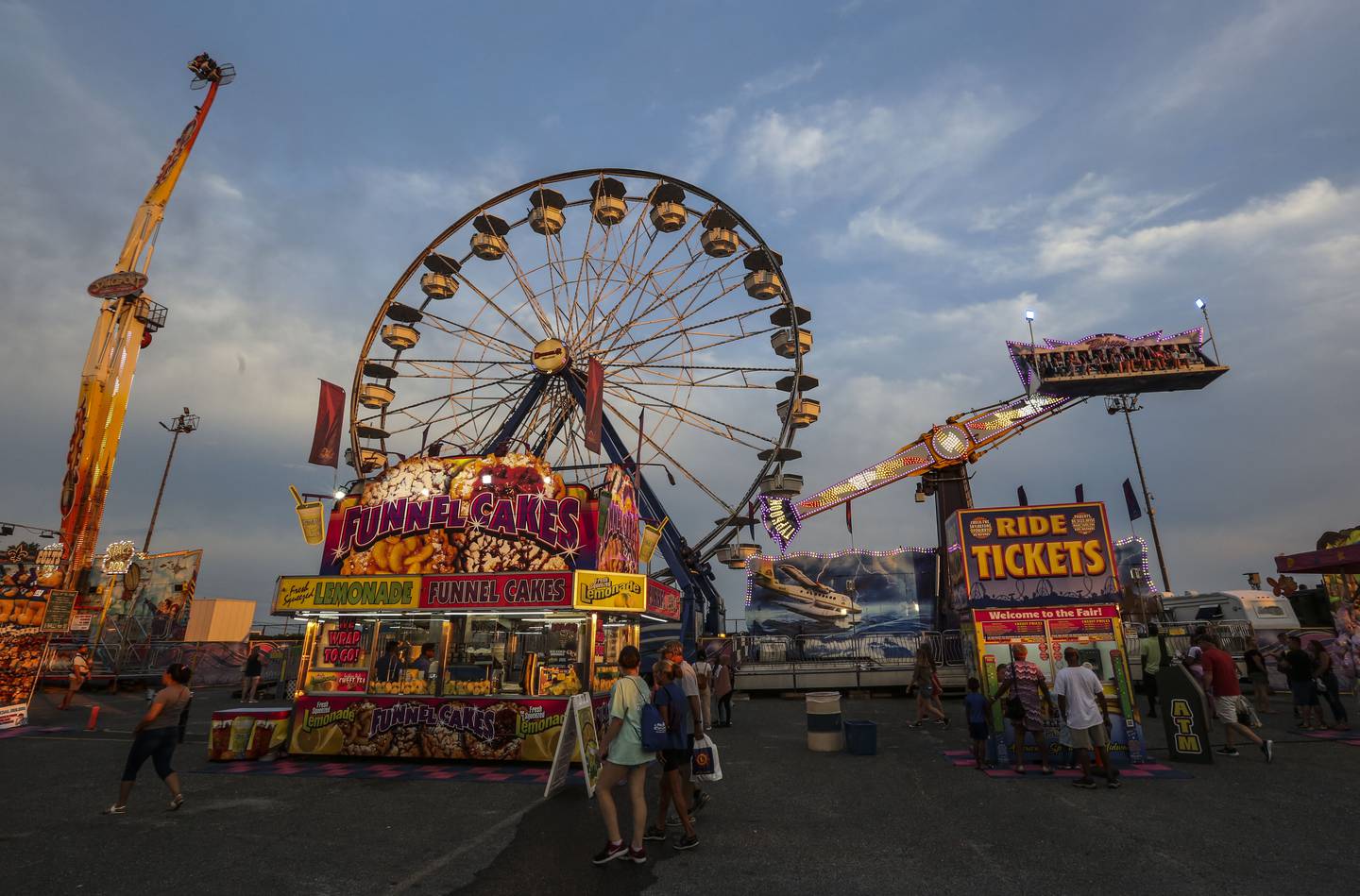People enjoy themselves at the Maryland State Fair on opening night in Timonium, MD on August 25, 2022.