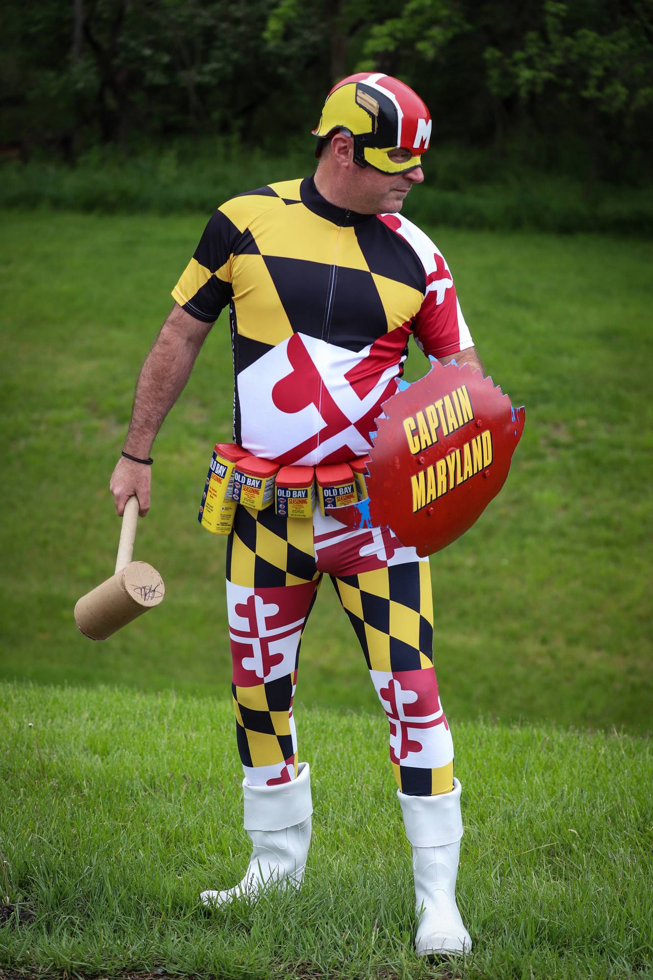 Clark Oliver wielding a crab mallet, Old Bay belt, and a crab shield as Captain Maryland.