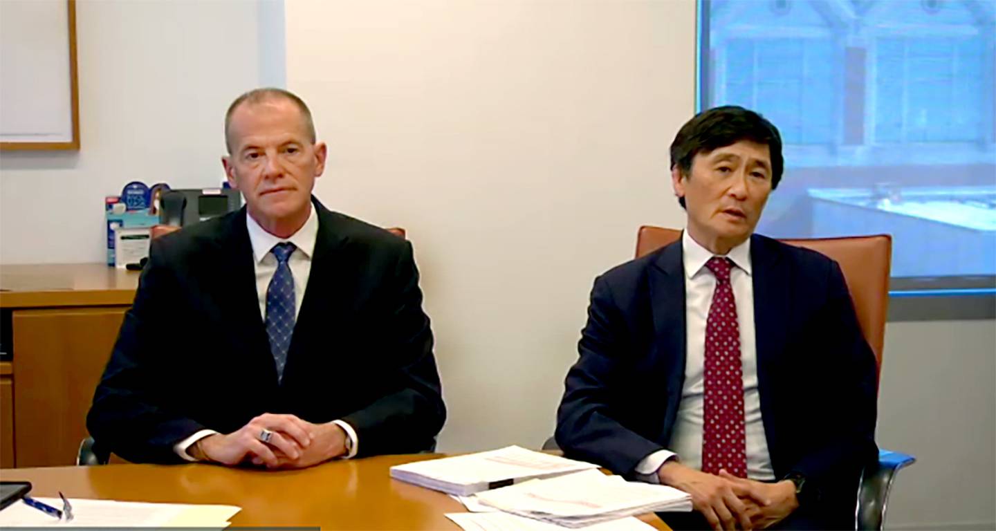 John Huffington, left, and Ropes & Gray partner Chong S. Park speak at a news conference on Nov. 9, 2021.
