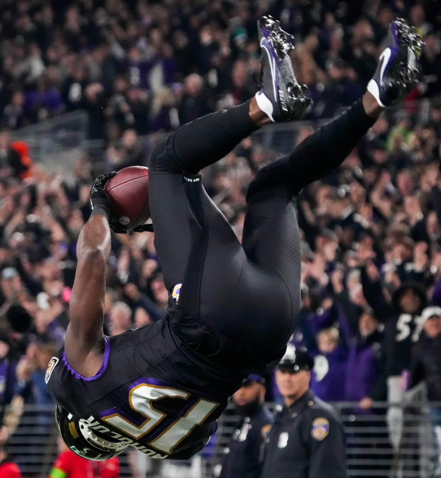 Baltimore Ravens wide receiver Nelson Agholor (15) does a flip after scoring a touchdown during the second quarter against the Cincinnati Bengals at M&T Bank Stadium on Thursday, Nov. 16, 2023.