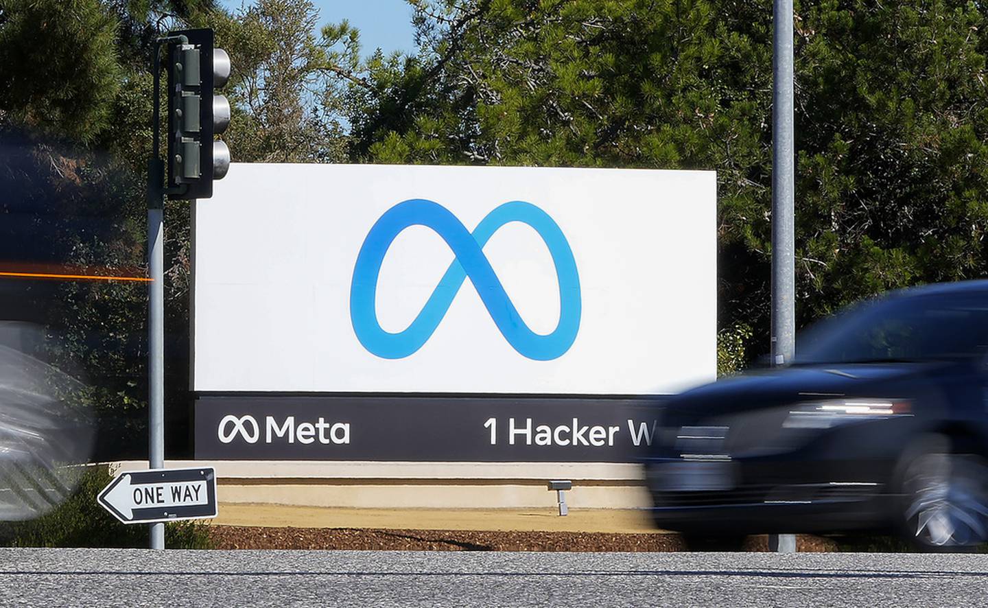 FILE - A car passes Facebook's new Meta logo on a sign at the company headquarters on Oct. 28, 2021, in Menlo Park, Calif. For the first time in a year, the big companies in the S&P 500 may be seeing their profits grow again. The company has been focusing on keeping costs lower, and Wall Street also expects its revenue growth accelerated during the latest quarter.