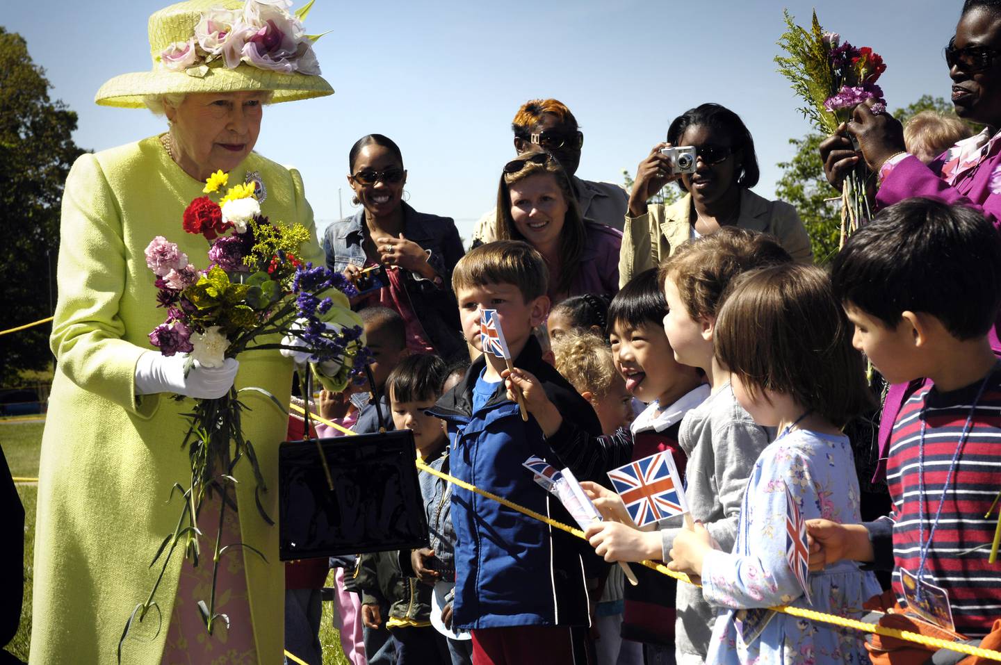 HM Queen Elizabeth II is greeted by children on her walk from NASA’s Goddard Space Flight Center mission control to a reception in the center’s main auditorium May 8, 2007 in Greenbelt, Maryland. The queen is on the last of a six-day visit to the U.S with her husband, Prince Philip, the Duke of Edinburgh.