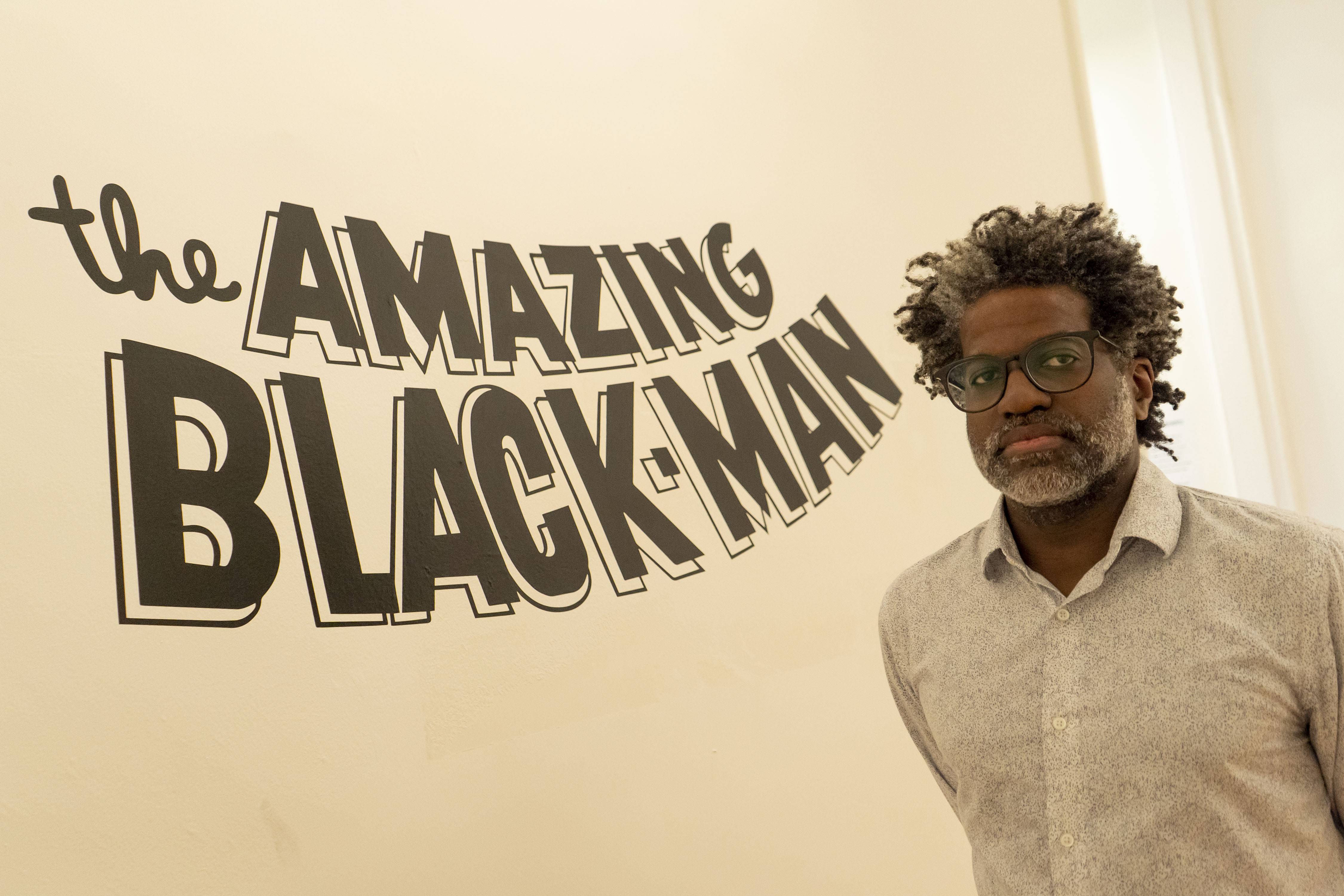 Kumasi Barnett in his exhibit, The Amazing Black Man, in the Peale Museum.
