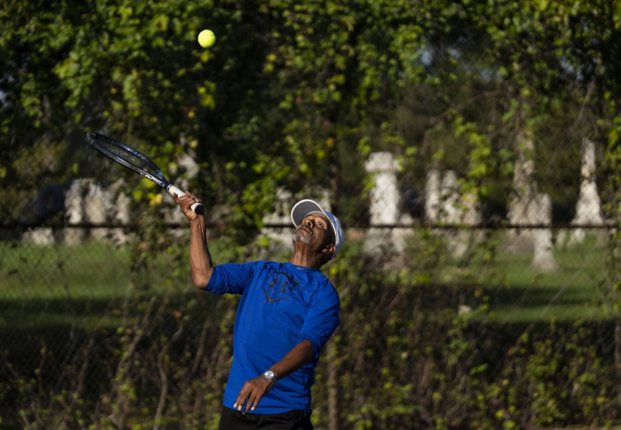 Donnie Fleet serves the ball during a tennis match at Druid Hill Park, in Baltimore, Friday, October 6, 2023.