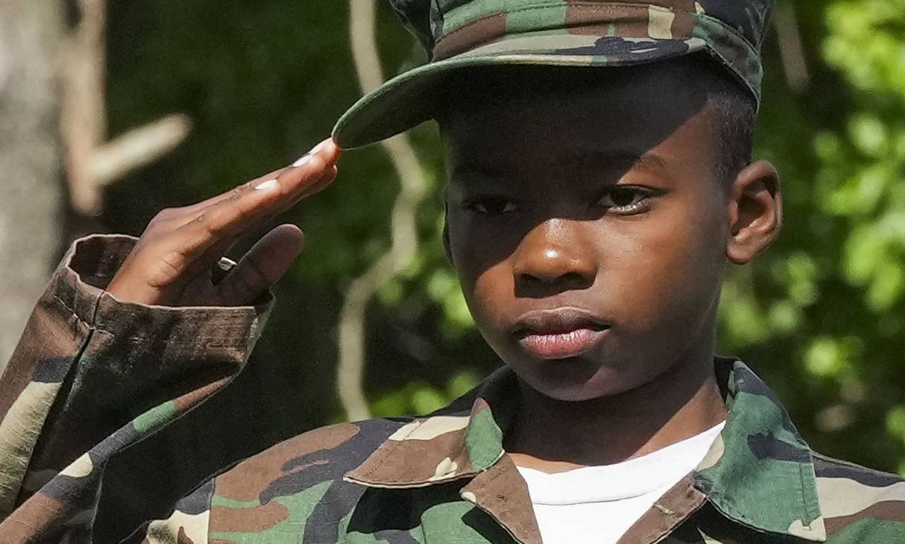 William Gerald, 12, salutes to gravesites at Dulaney Valley Memorial Gardens on May 27, 2023. Dulaney Valley Memorial Gardens on May 27, 2023.