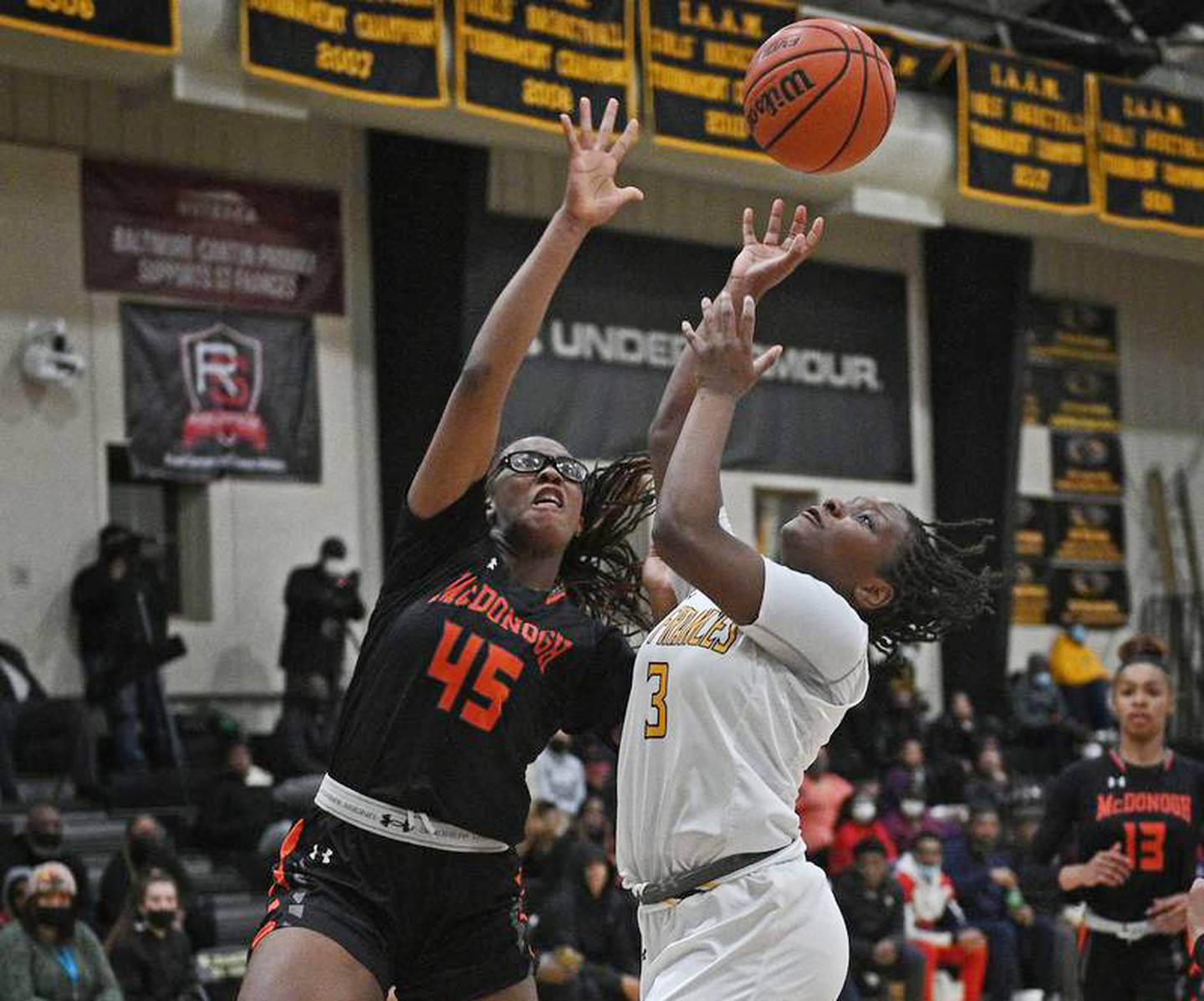 McDonogh's Kennedy Umeh (left), an all-around superstar, displays her defensive prowess in a contest against St. Frances last season.