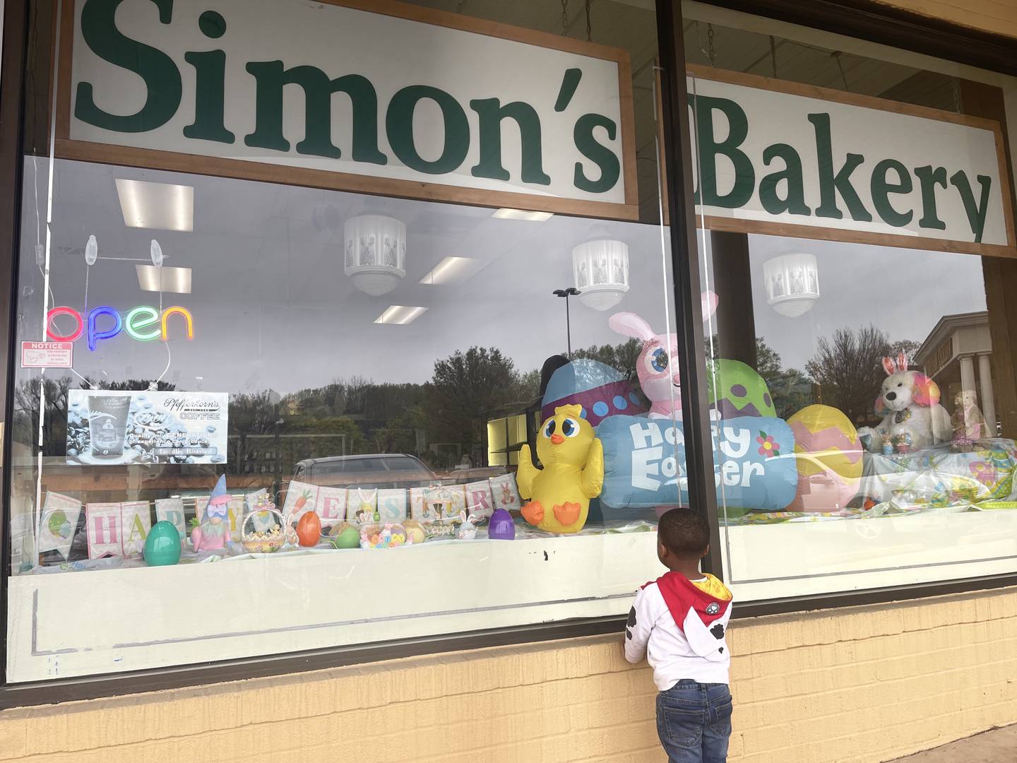 Taeden Sidney, age 3, admires an Easter display at Simon's Bakery. The shop, whose roots in Baltimore go back to the 1800s, is up for sale.
