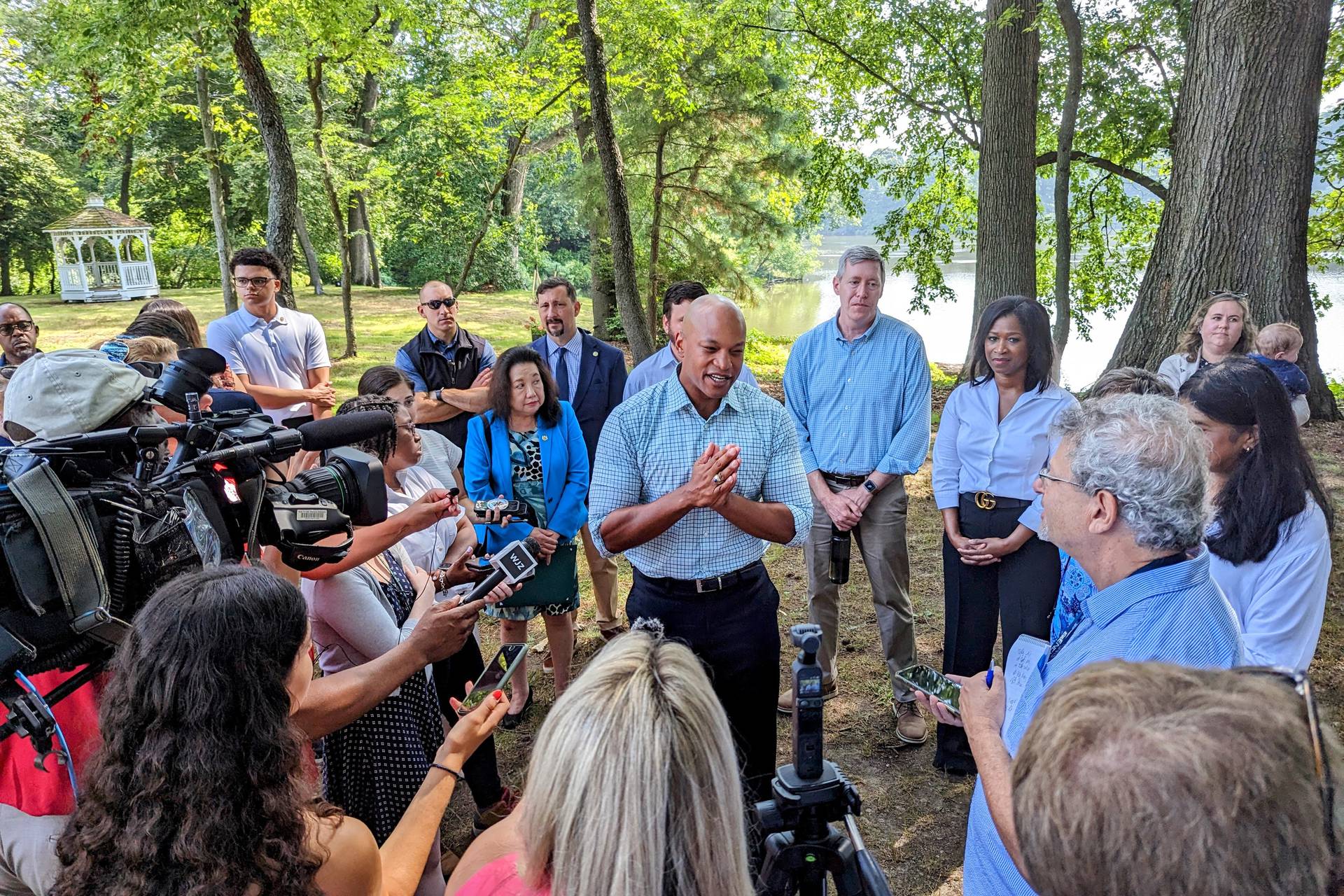 Surrounded by members of his cabinet, Gov. Wes Moore talks to reporters at Wye Island Natural Resources Management Area on Thursday, July 20, 2023 after announcing a change in state policy on Chesapeake Bay Clean up.