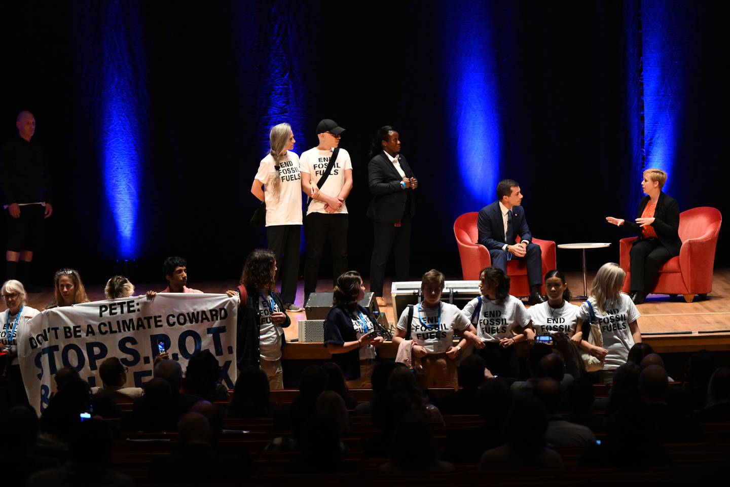 A group of protestors from Climate Defiance interrupt a discussion with Secretary of Transportation Pete Buttigieg at Impact Maryland, a thought leadership conference hosted by The Baltimore Banner Tuesday, Oct.10, 2023 in Baltimore.