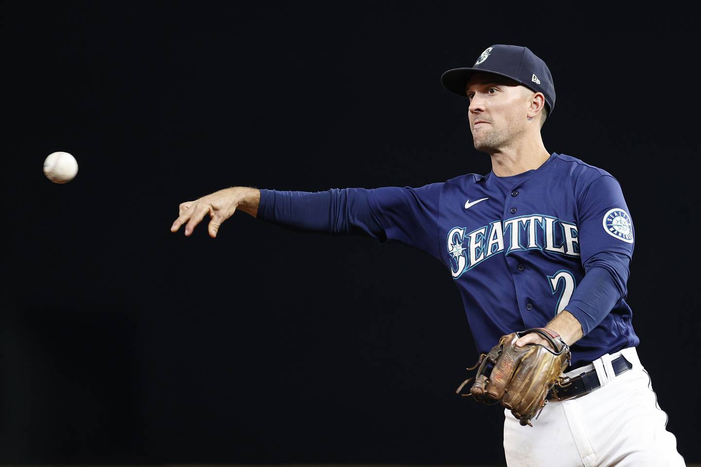 SEATTLE, WASHINGTON - OCTOBER 03: Adam Frazier #26 of the Seattle Mariners throws to first base during the fourth inning against the Detroit Tigers at T-Mobile Park on October 03, 2022 in Seattle, Washington.