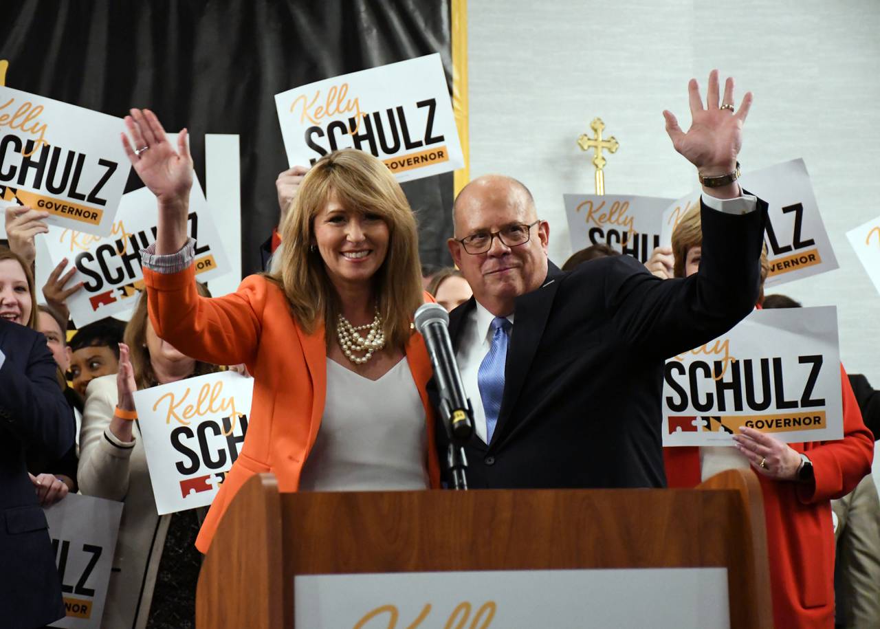 Maryland Republican candidate for governor Kelly Schulz and Gov. Larry Hogan wave to supporters after Hogan announced his official endorsement of Schulz during an event in Annapolis on March 22, 2022.