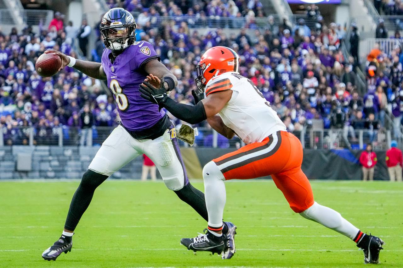 Baltimore Ravens quarterback Lamar Jackson (8) throws the ball during the fourth quarter against the Cleveland Browns at M&T Bank Stadium on Sunday, Nov. 12, 2023.
